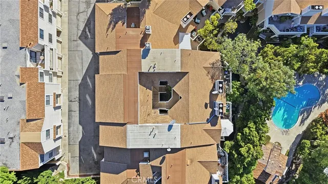 an aerial view of a house with a yard and garden