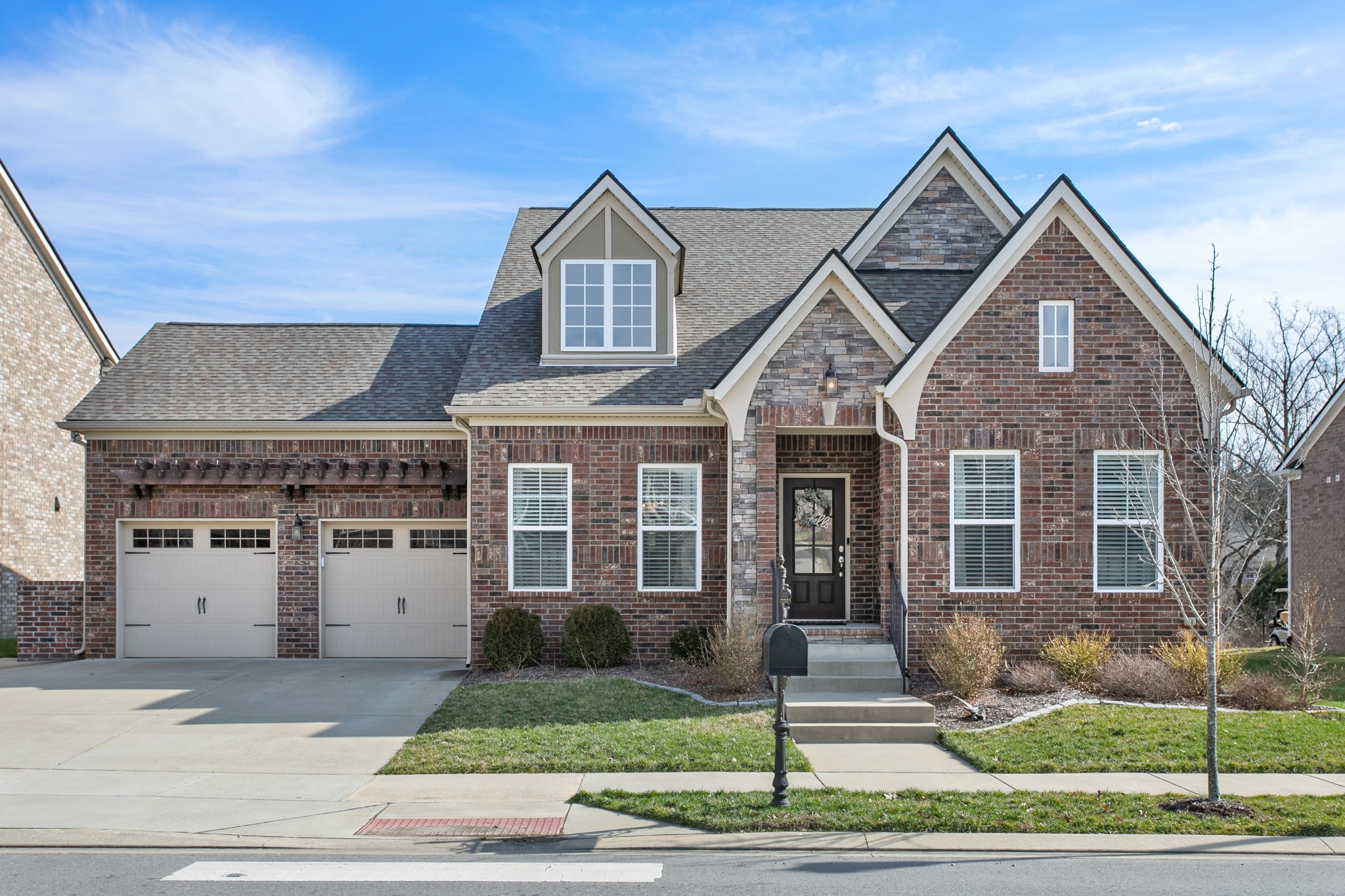a front view of a house with a yard