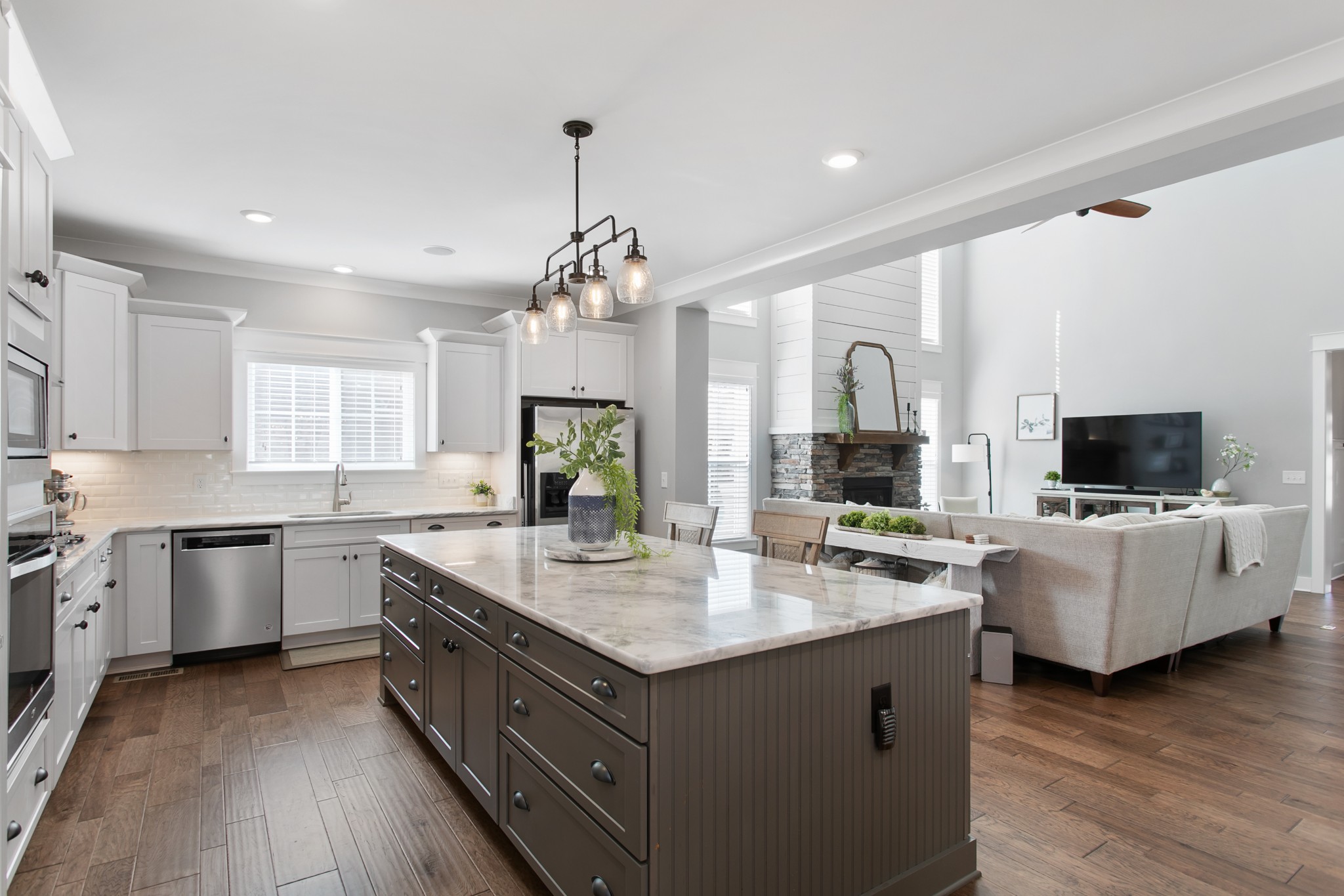 700 Beamon Drive Franklin, TN 37064 - Photo 12 of 47 a large kitchen with stainless steel appliances granite countertop a lot of counter space and wooden floors