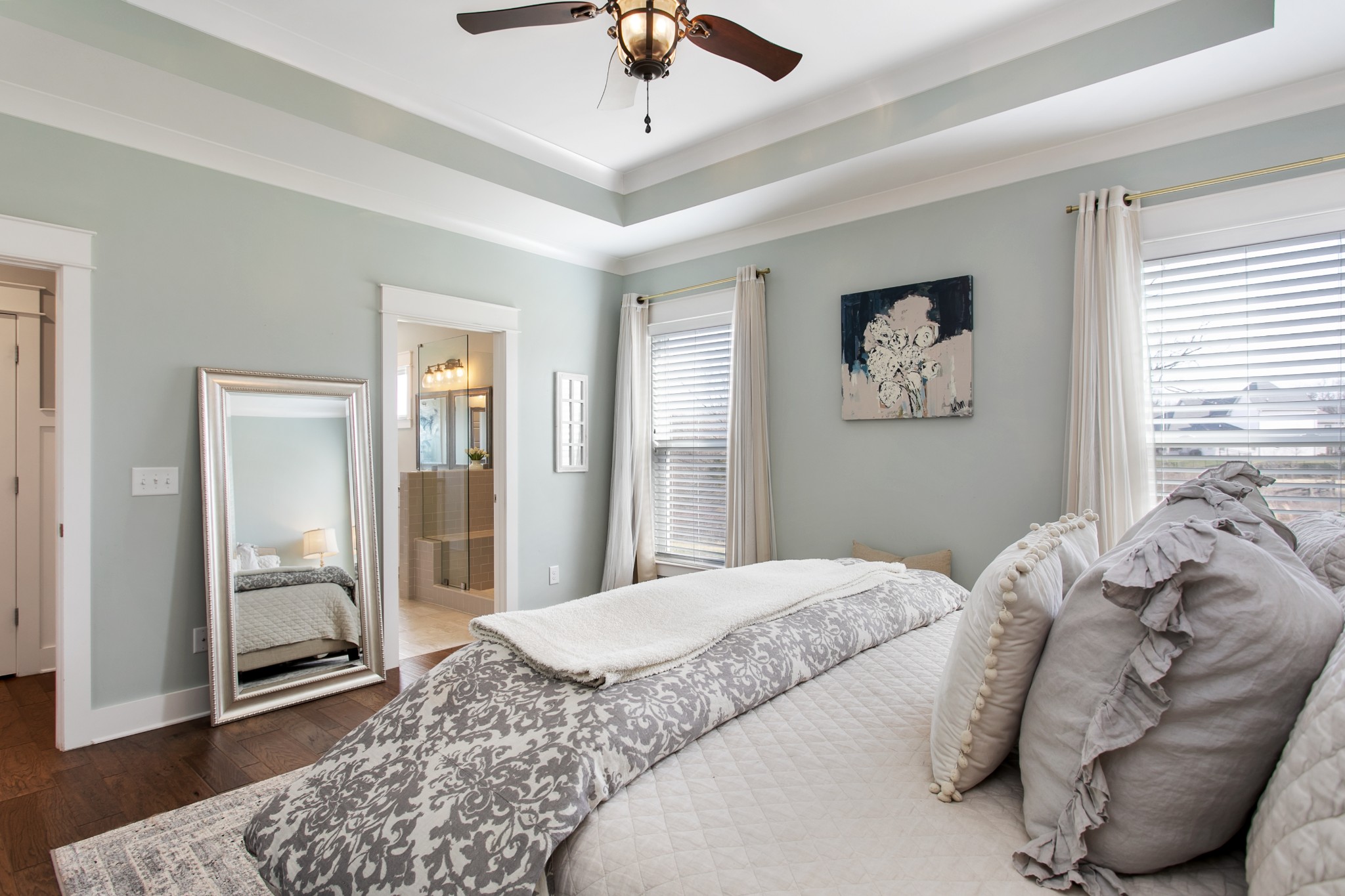 700 Beamon Drive Franklin, TN 37064 - Photo 24 of 47 a bedroom with a large bed and a chandelier