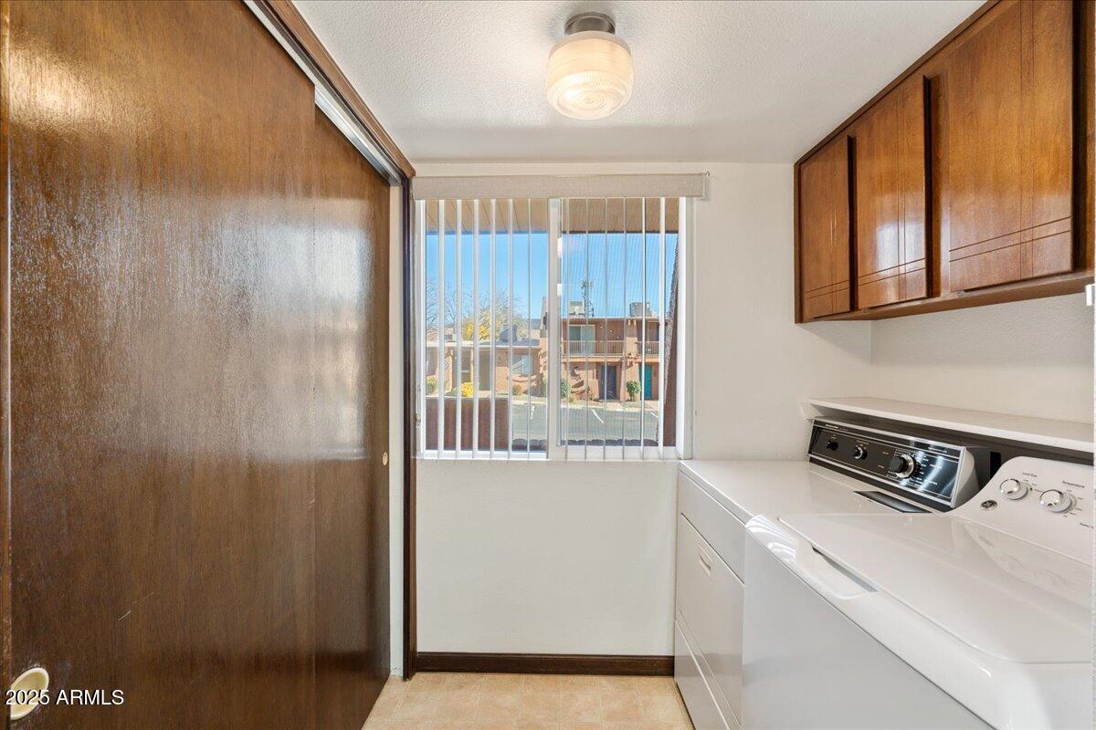 130 Castle Rock Road, Unit 83 Sedona, AZ 86351 - Photo 14 of 32 a kitchen with a refrigerator and a window