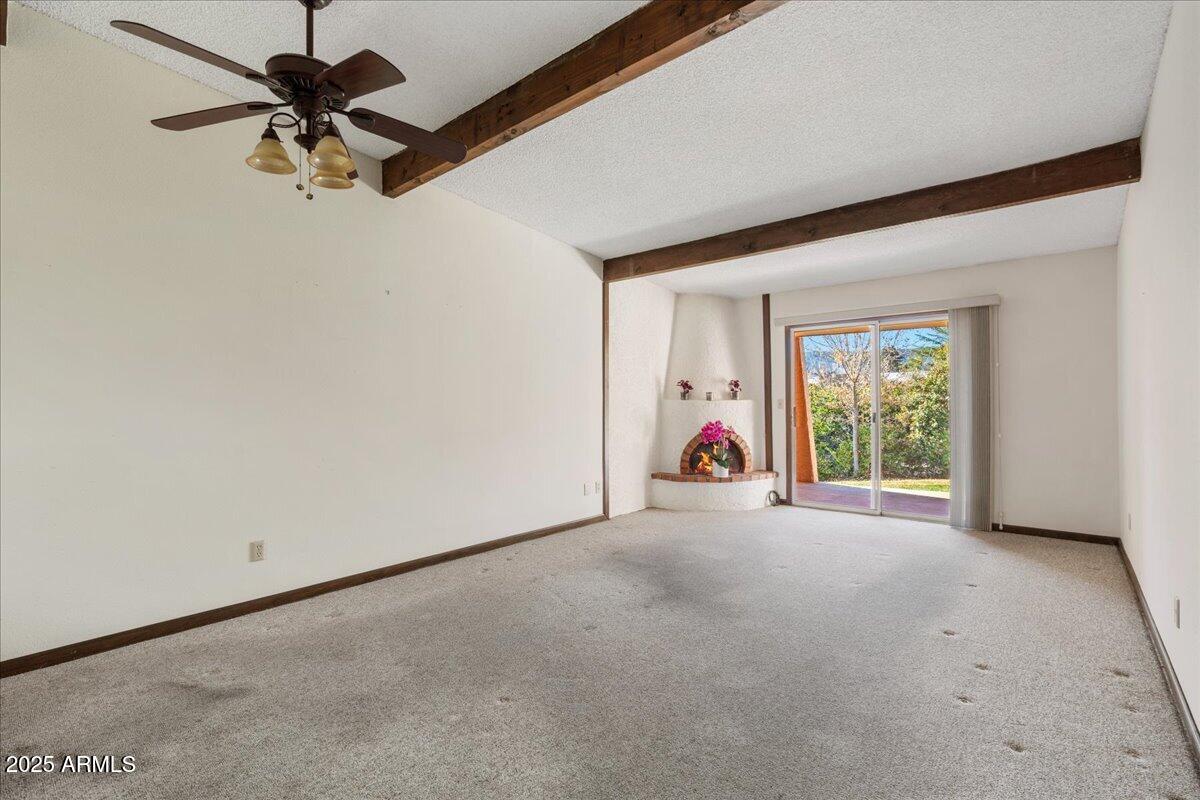 130 Castle Rock Road, Unit 83 Sedona, AZ 86351 - Photo 16 of 32 a view of a livingroom with a window and a ceiling fan