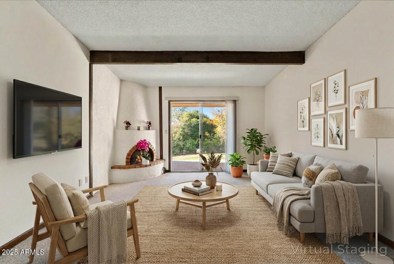 130 Castle Rock Road, Unit 83 Sedona, AZ 86351 - Photo 17 of 32 a living room with furniture and a flat screen tv