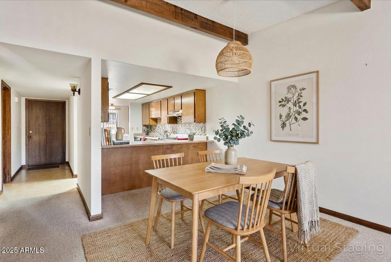 130 Castle Rock Road, Unit 83 Sedona, AZ 86351 - Photo 3 of 32 a dining room with a table and chairs