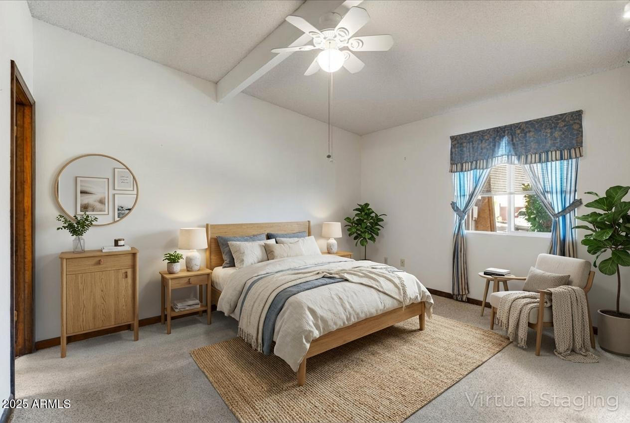 130 Castle Rock Road, Unit 83 Sedona, AZ 86351 - Photo 5 of 32 a bedroom with a bed and a chandelier