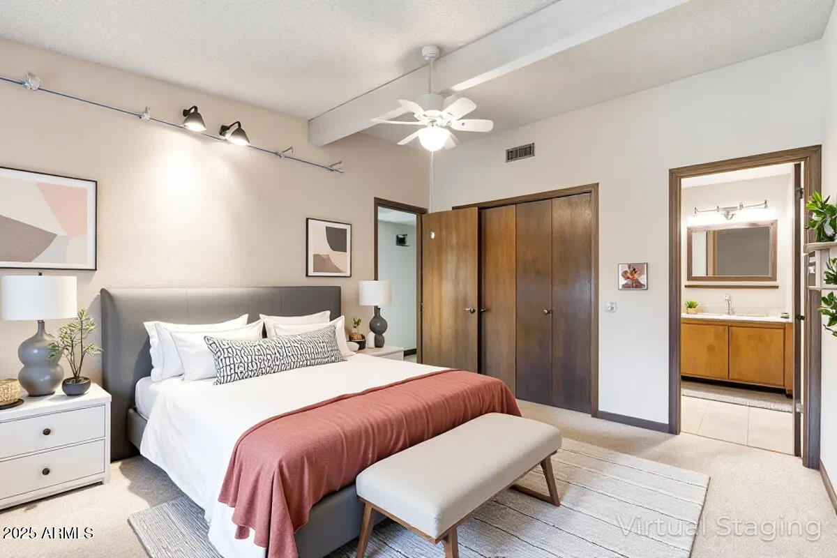 130 Castle Rock Road, Unit 83 Sedona, AZ 86351 - Photo 6 of 32 a bedroom with a bed and a chandelier