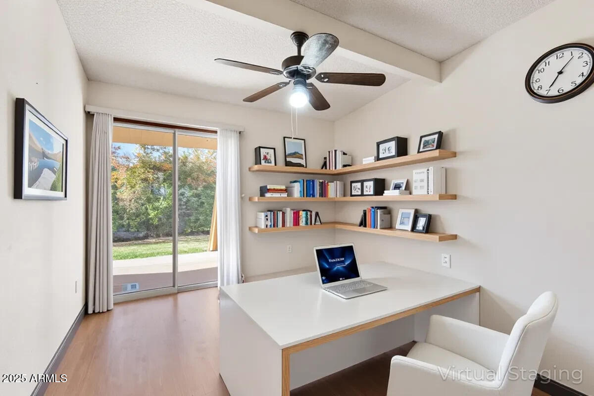 130 Castle Rock Road, Unit 83 Sedona, AZ 86351 - Photo 7 of 32 a workspace with a bookshelf