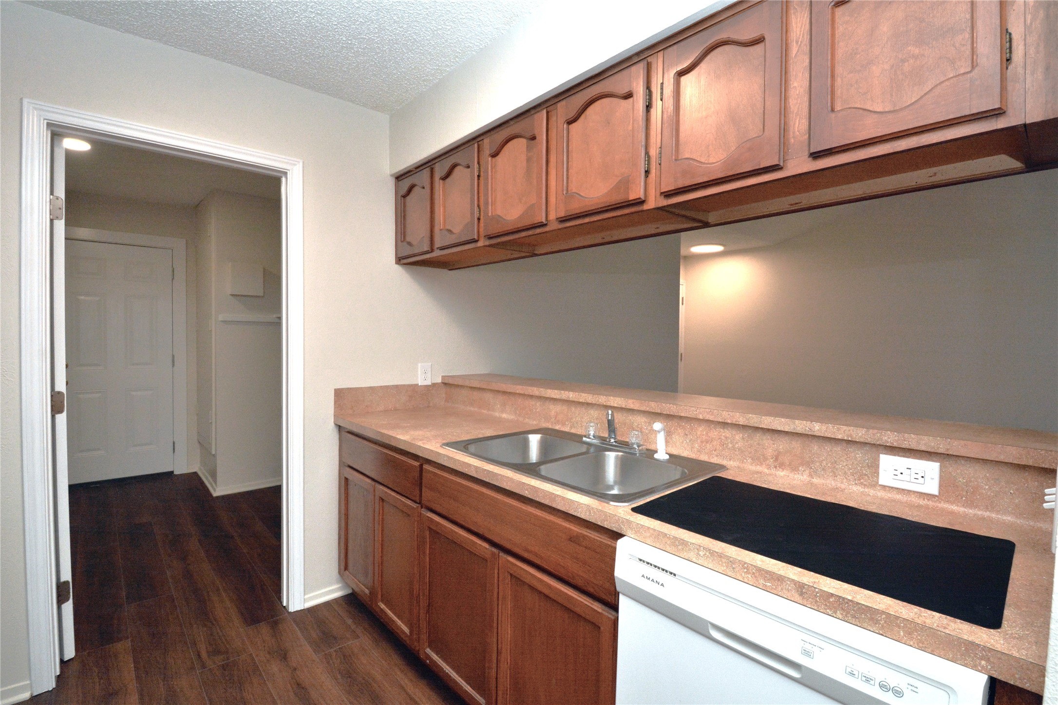 11314 Walnut Ridge Drive, Unit B Austin, TX 78753 - Photo 8 of 19 A well-appointed kitchen features rich wood cabinetry and ample counter space.