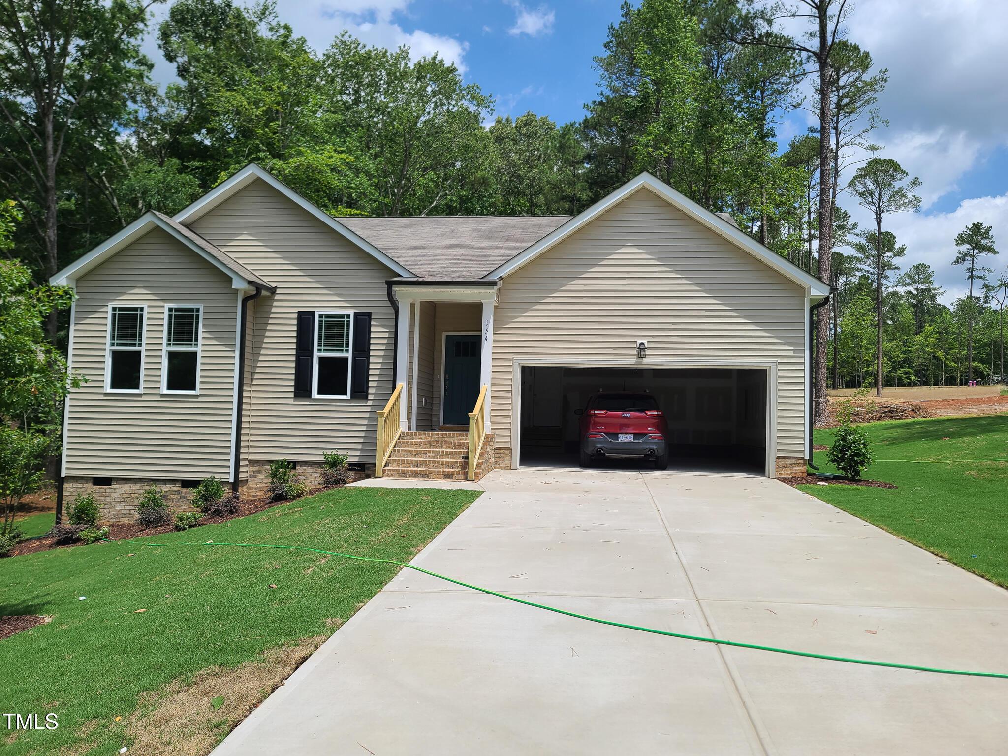 a front view of a house with yard