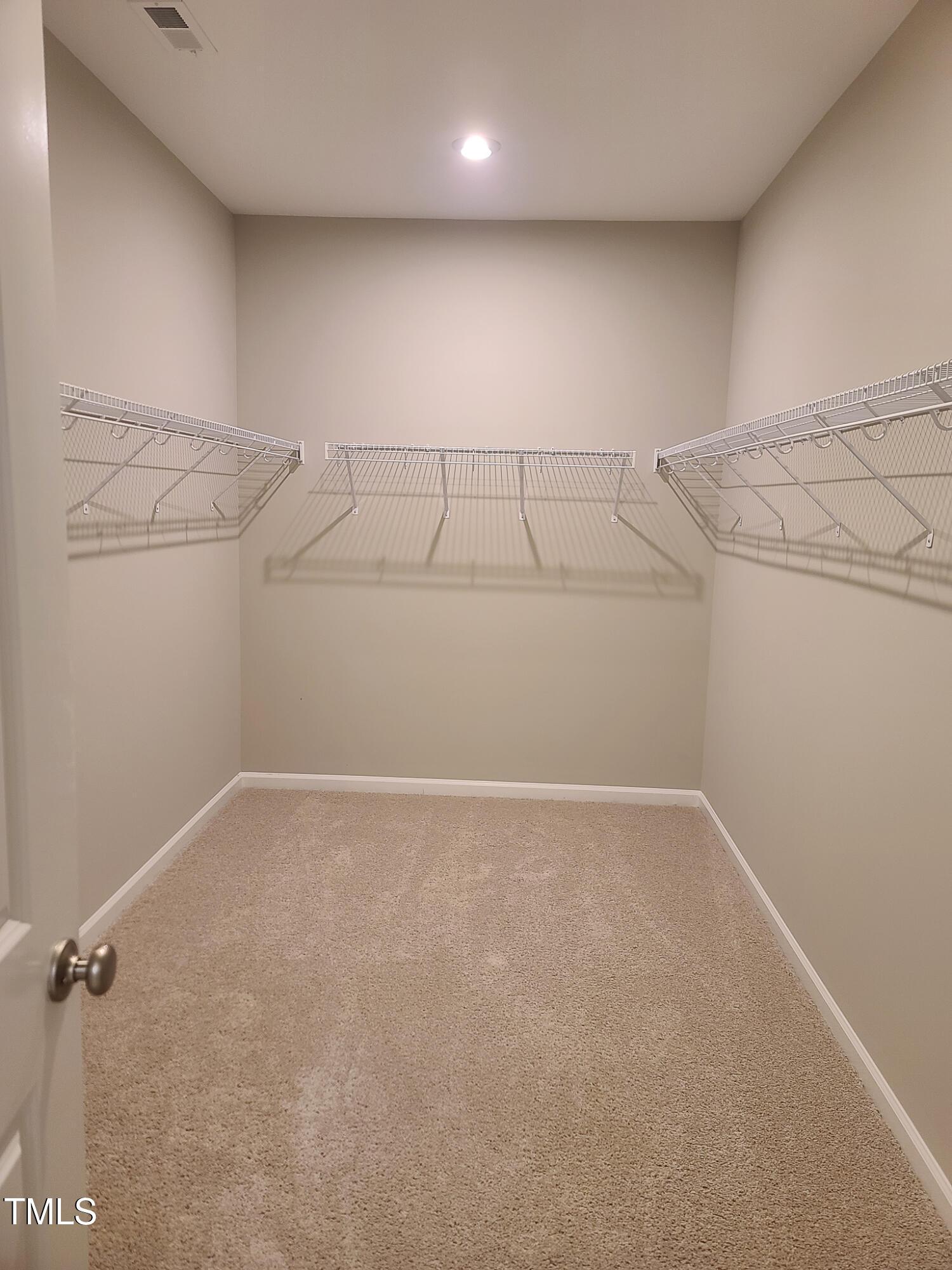 154 Black Cloud Drive Louisburg, NC 27549 - Photo 17 of 28 a view of a room with racks on the wall