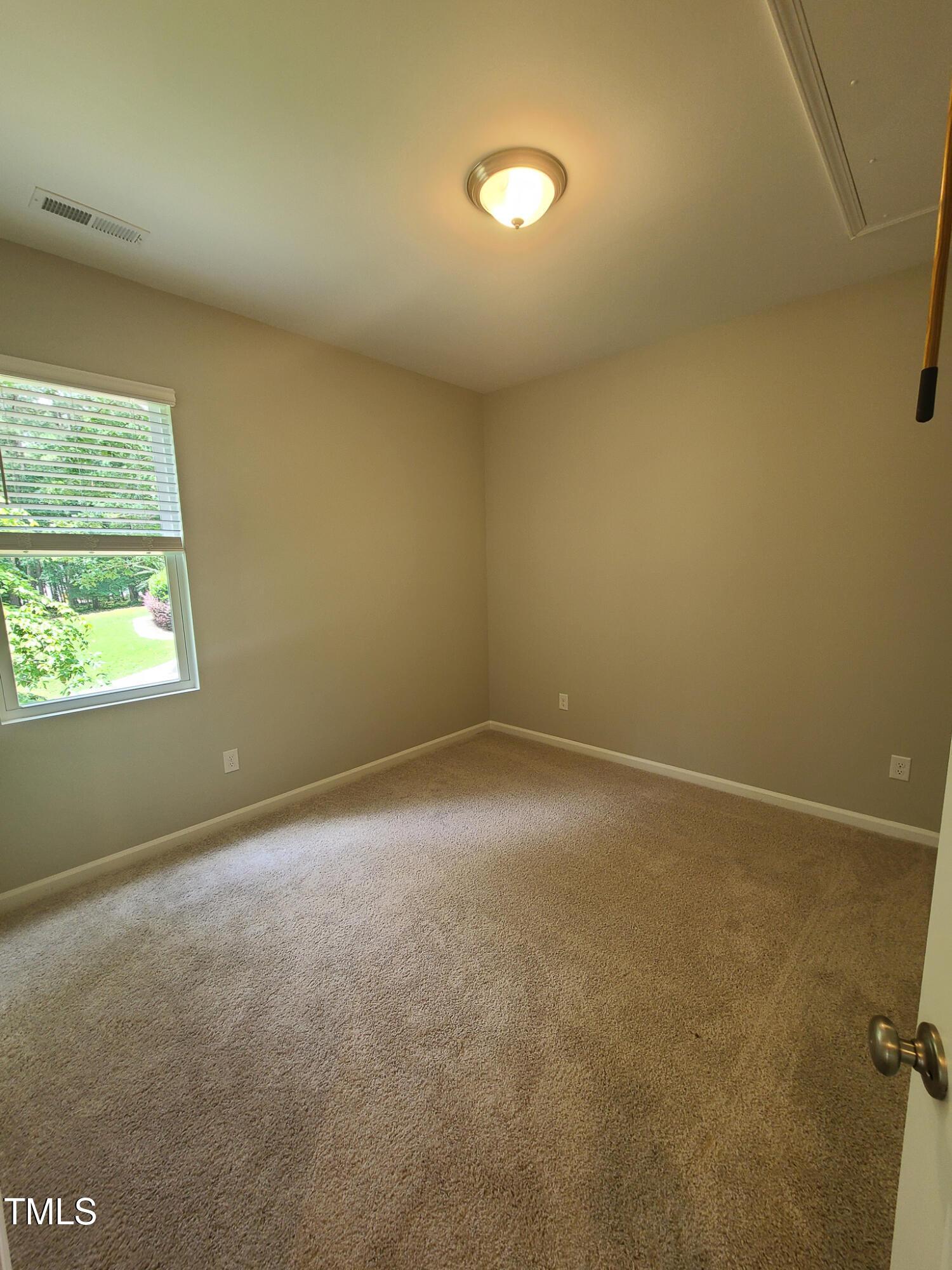154 Black Cloud Drive Louisburg, NC 27549 - Photo 20 of 28 an empty room with a empty space and a window