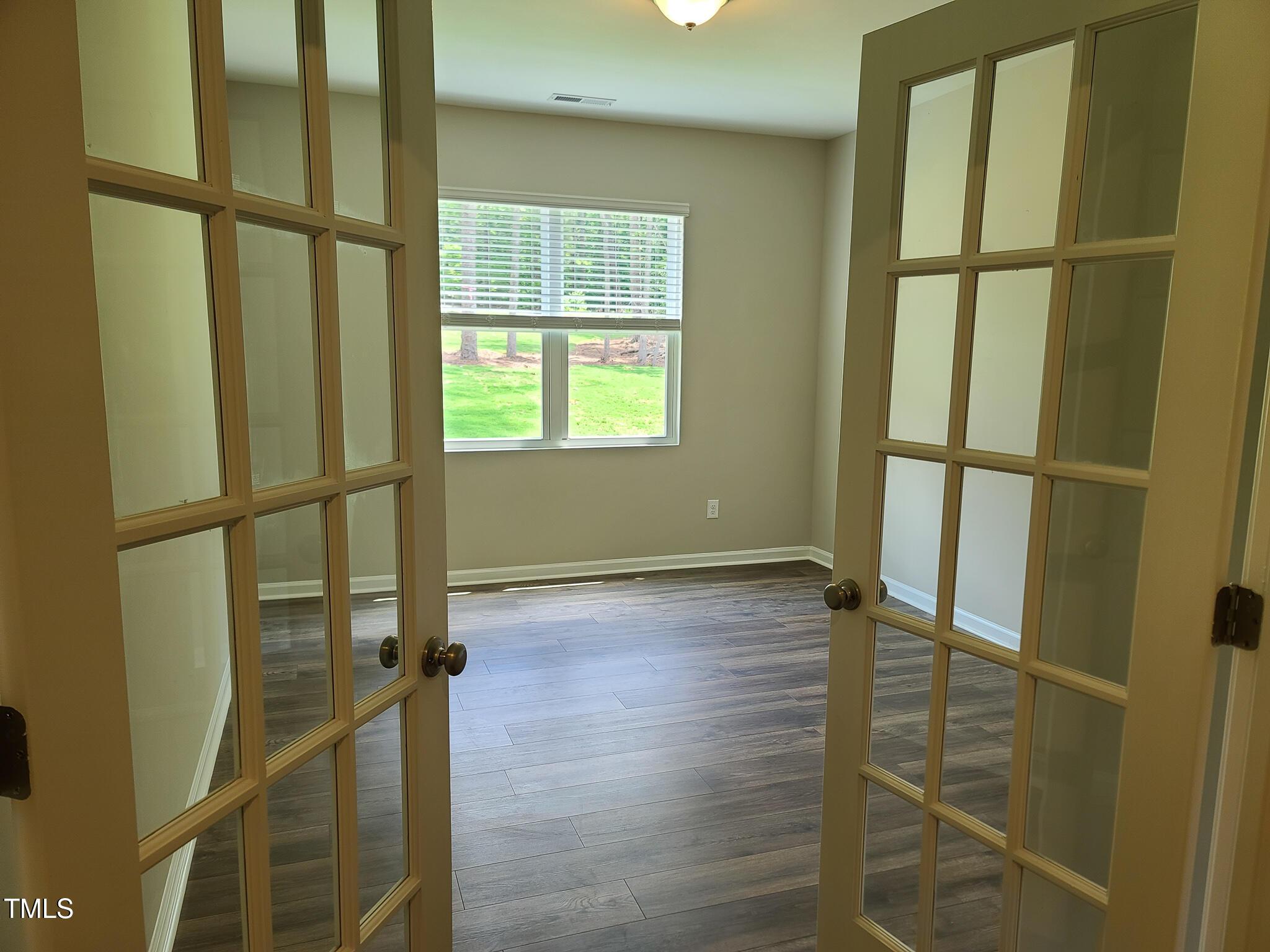 154 Black Cloud Drive Louisburg, NC 27549 - Photo 4 of 28 a view of an empty room with a window