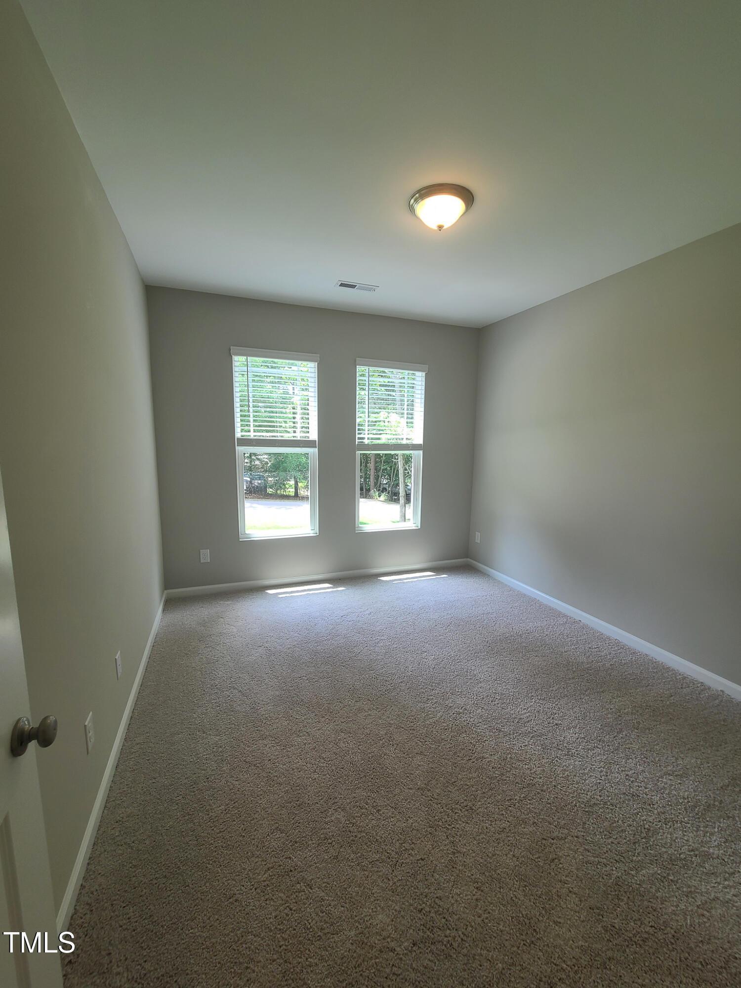 154 Black Cloud Drive Louisburg, NC 27549 - Photo 10 of 28 an empty room with windows