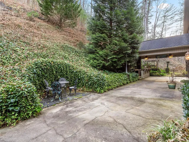 a view of backyard with outdoor seating and green space