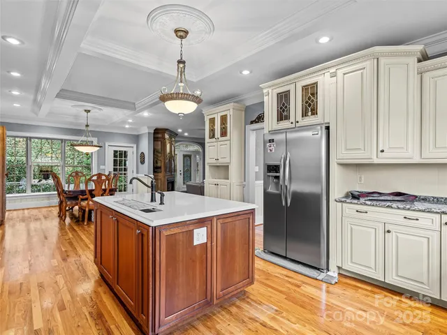 a kitchen with stainless steel appliances granite countertop a stove and a refrigerator