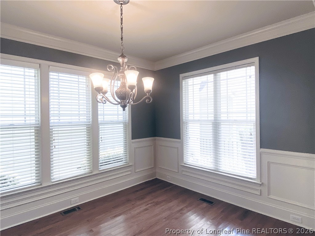 175 Pine Hawk Drive Spring Lake, NC 28390 - Photo 8 of 43 a view of an empty room with wooden floor and a window