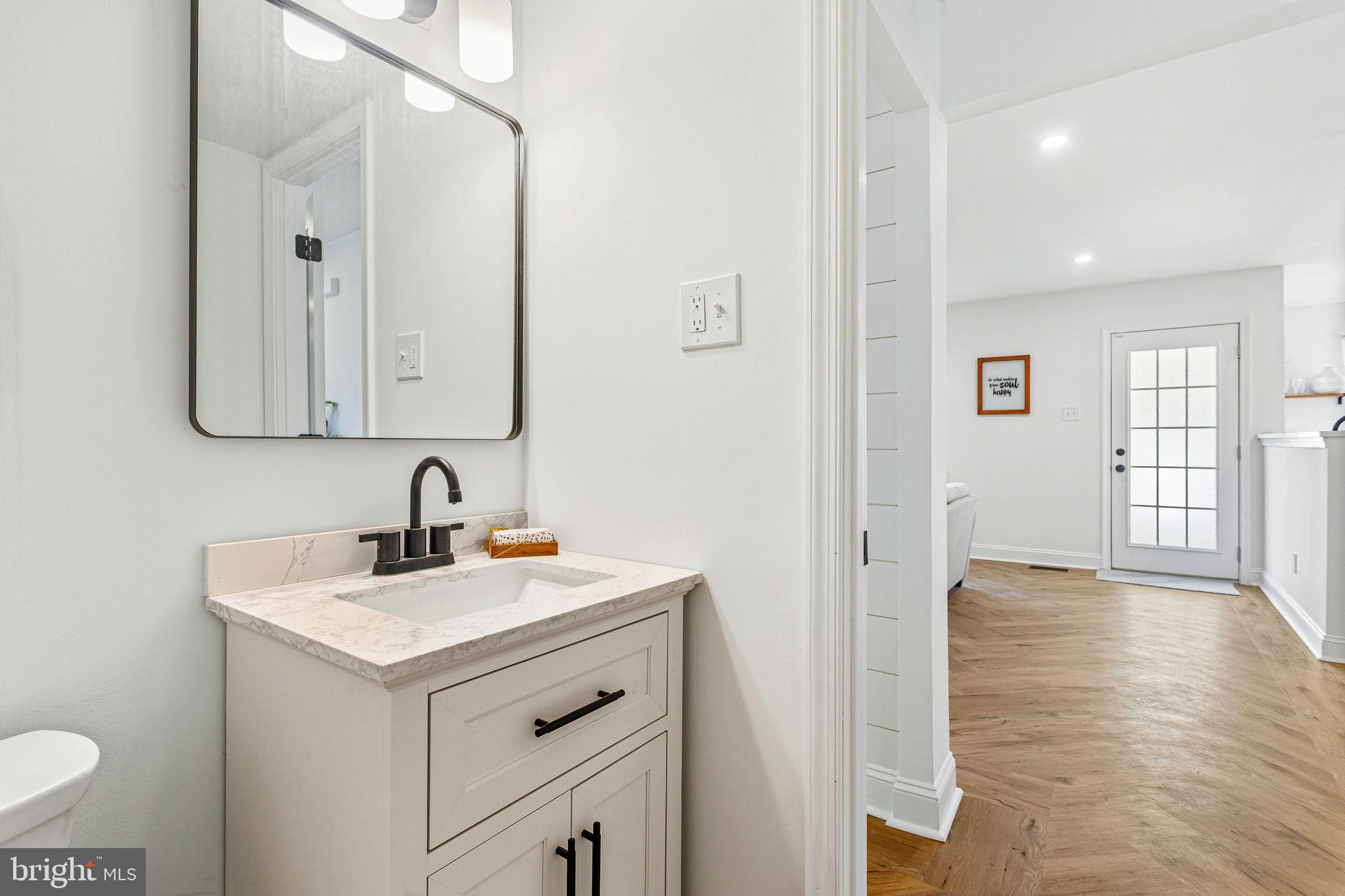 15162 Wayside Road Philadelphia, PA 19116 - Photo 17 of 34 a bathroom with a sink and a mirror