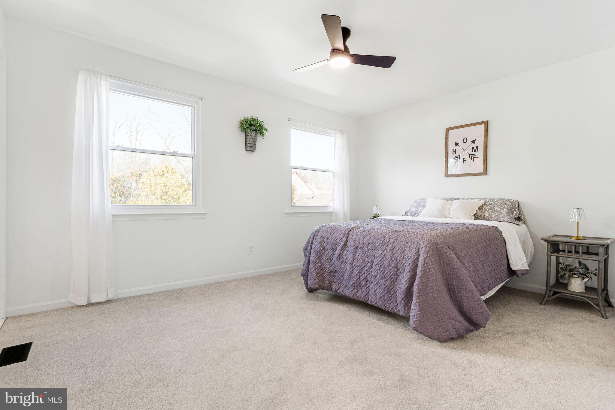 15162 Wayside Road Philadelphia, PA 19116 - Photo 21 of 34 a spacious bedroom with a bed and a window