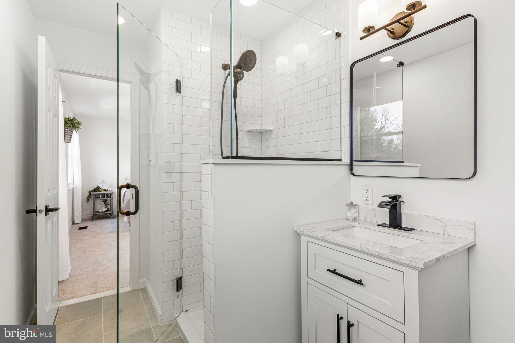15162 Wayside Road Philadelphia, PA 19116 - Photo 27 of 34 a bathroom with a sink and a mirror