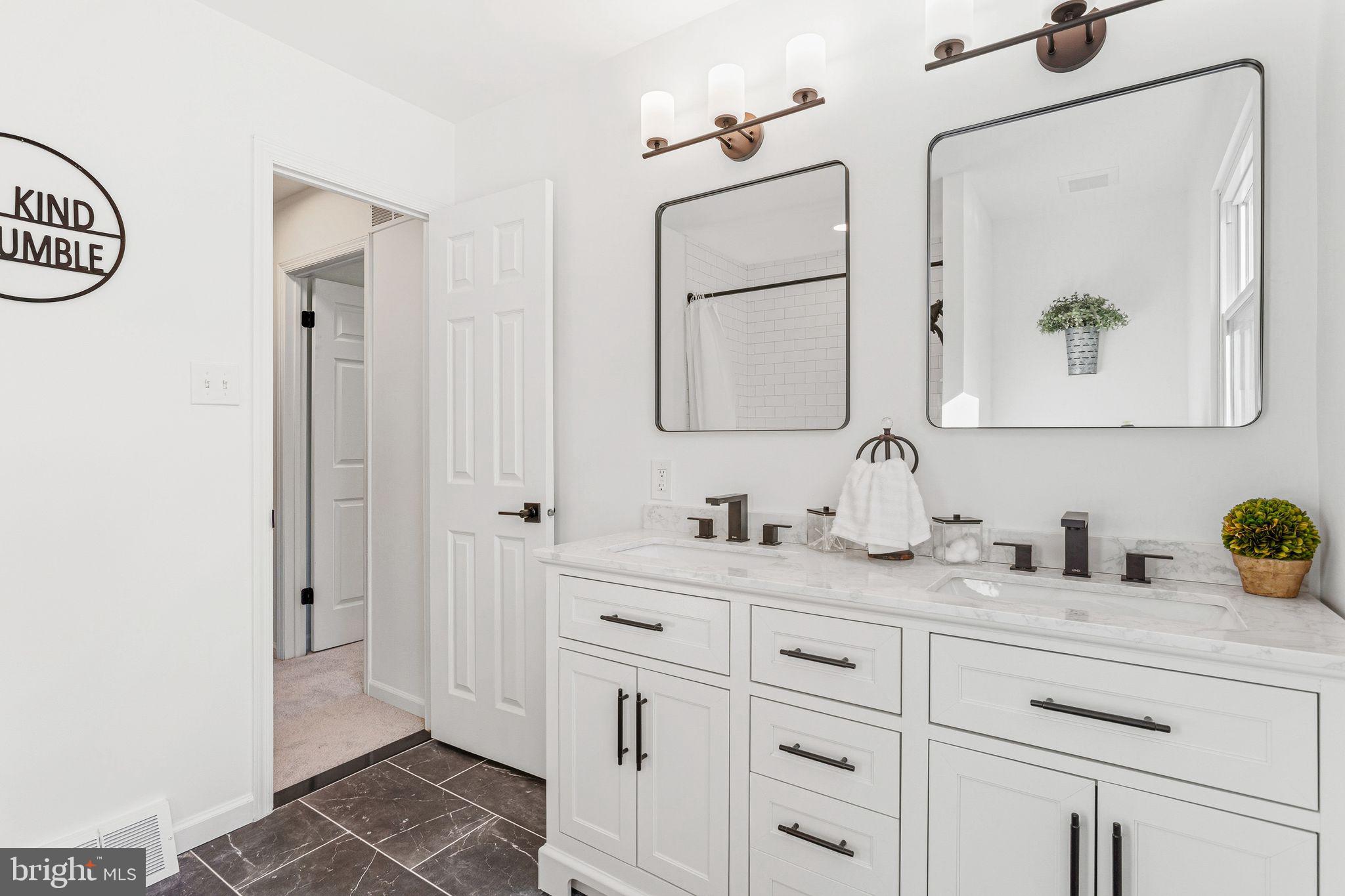 15162 Wayside Road Philadelphia, PA 19116 - Photo 29 of 34 a bathroom with a sink and a mirror