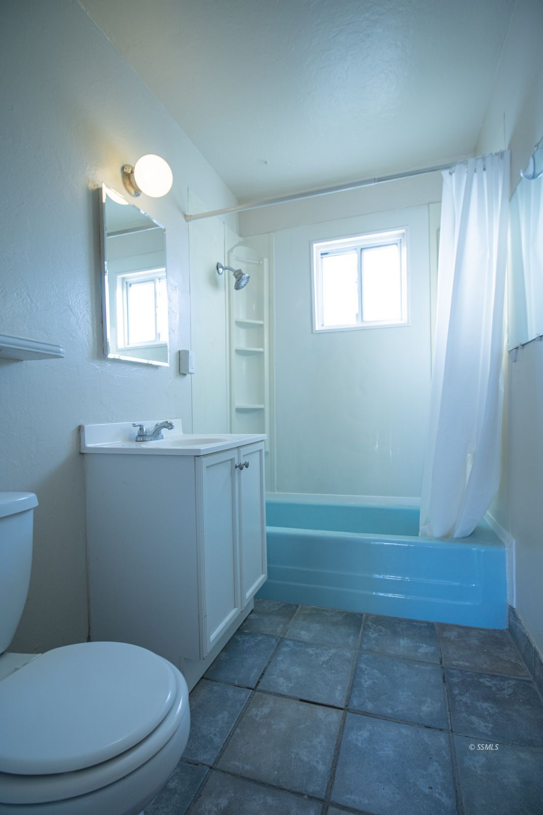 1621 Sims Street Ridgecrest, CA 93555 - Photo 19 of 24 a bathroom with a sink a toilet and tub