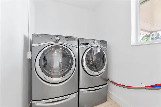 a utility room with dryer and washer