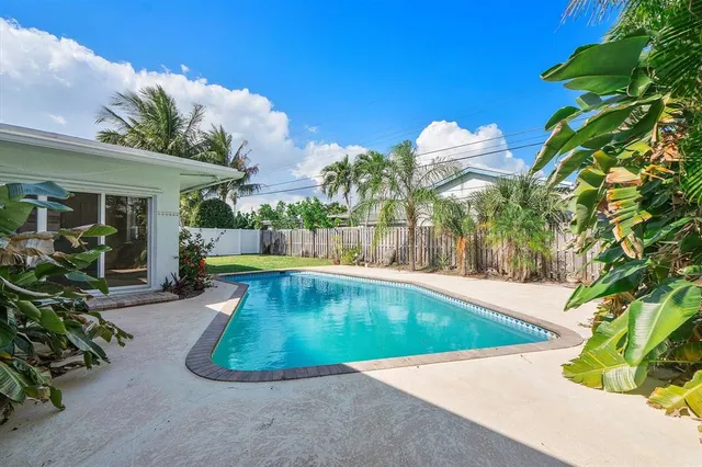 a view of a swimming pool with a patio