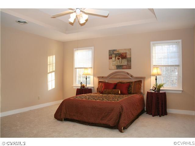 12904 Rockridge Road Chester, VA 23831 - Photo 12 of 12 a bedroom with a large bed and a window