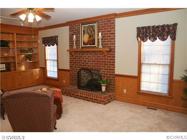 12904 Rockridge Road Chester, VA 23831 - Photo 9 of 12 a bedroom with a bed and a window