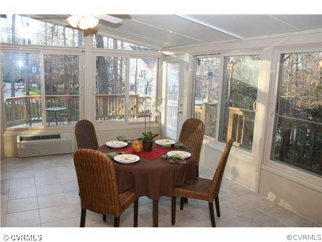 12904 Rockridge Road Chester, VA 23831 - Photo 10 of 12 a dining room with furniture and large windows