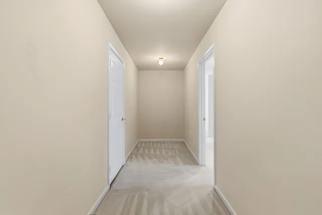 a view of backyard with swimming pool and green space