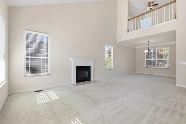 a view of a chandelier fan and windows