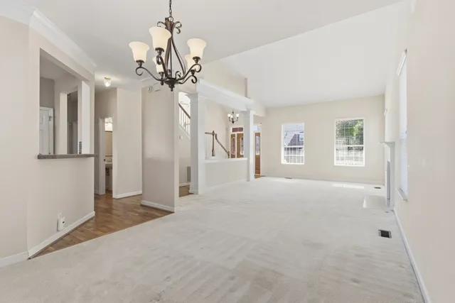 a kitchen with stainless steel appliances kitchen island granite countertop a refrigerator and a stove top oven