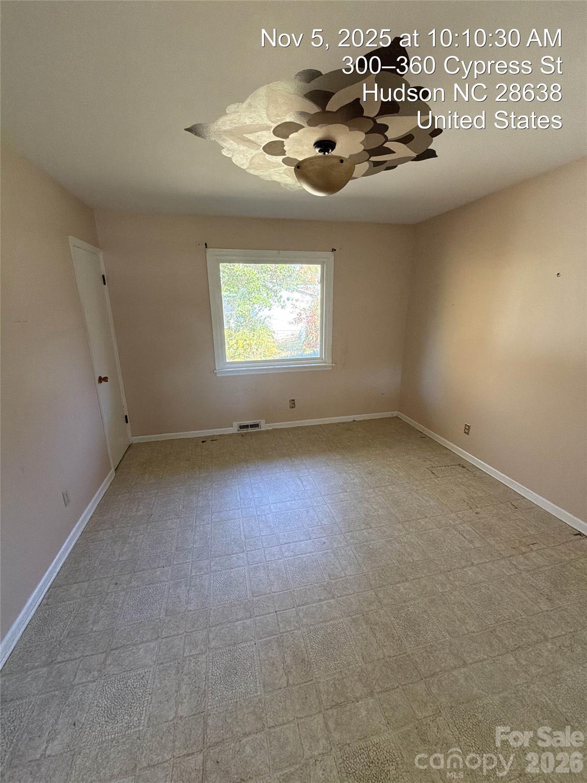 332 Legion Road Hudson, NC 28638 - Photo 3 of 13 en empty room with windows and ceiling fan