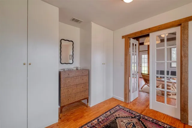 a bedroom with a bed and a view of bedroom