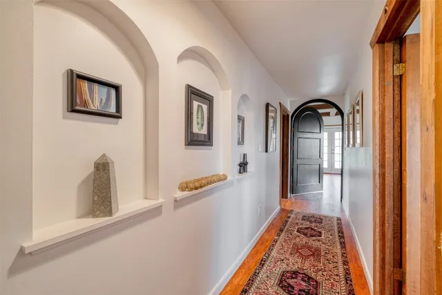 a view of a bedroom with furniture and window