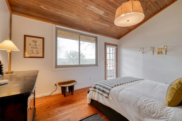 a bedroom with a bed and a desk