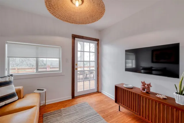 a view of a livingroom with furniture and a flat screen tv
