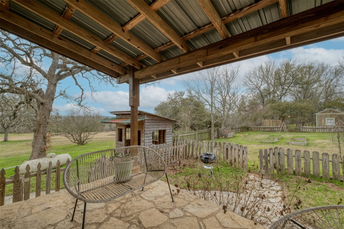 317 Walnut Creek Road Bastrop, TX 78602 - Photo 28 of 33 a view of a patio with table and chairs and potted plants
