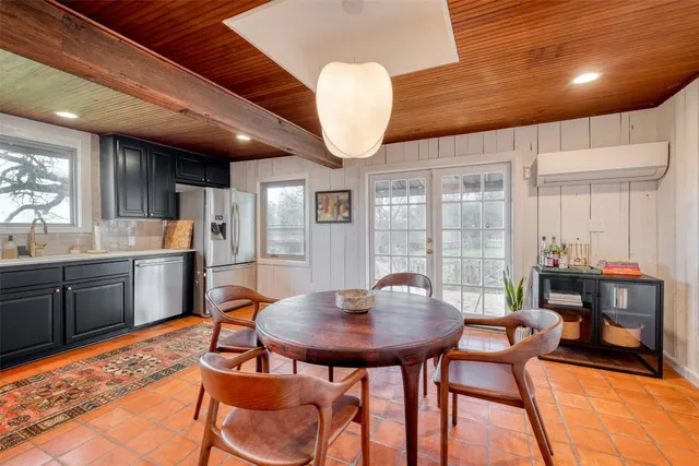 a view of a dining room with furniture and window