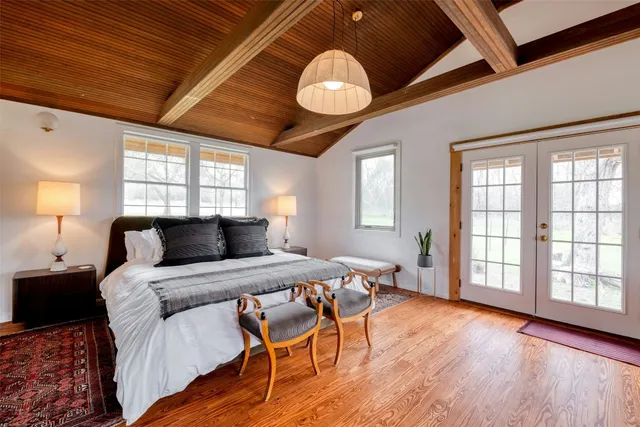 a view of a livingroom with furniture window and wooden floor