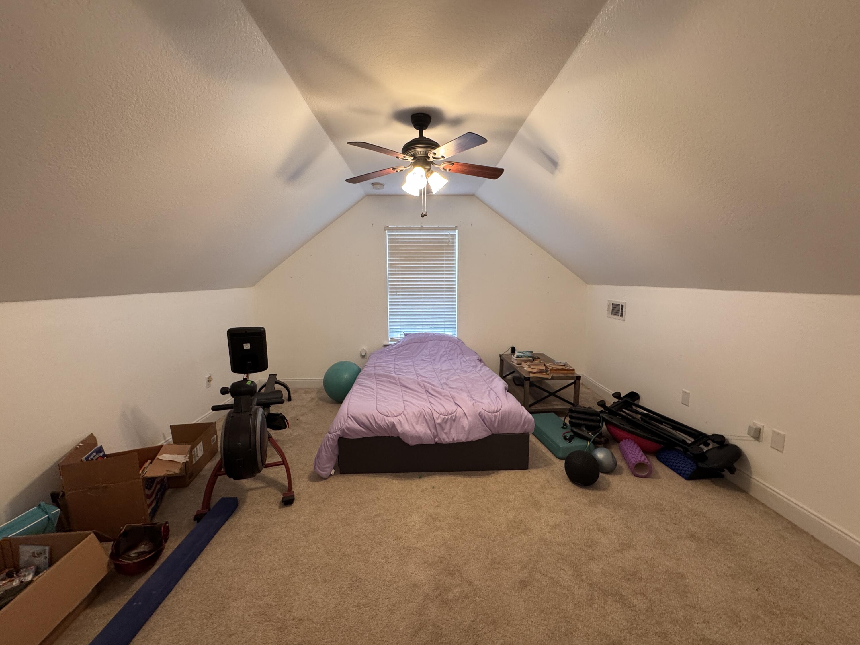 4413 Mirada Way Crestview, FL 32539 - Photo 15 of 27 a bed room with furniture and chandelier