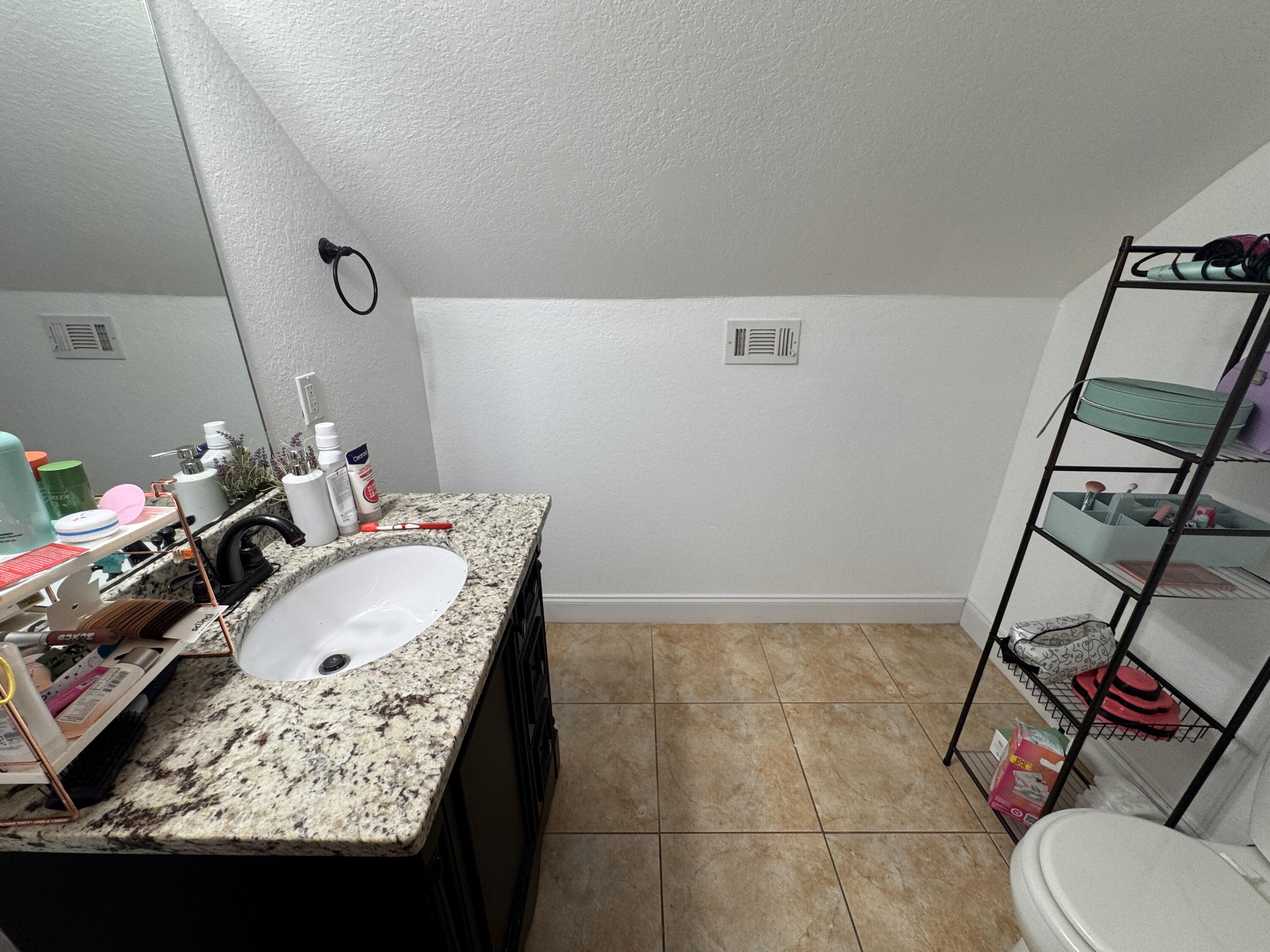 4413 Mirada Way Crestview, FL 32539 - Photo 16 of 27 a bathroom with a sink and toilet