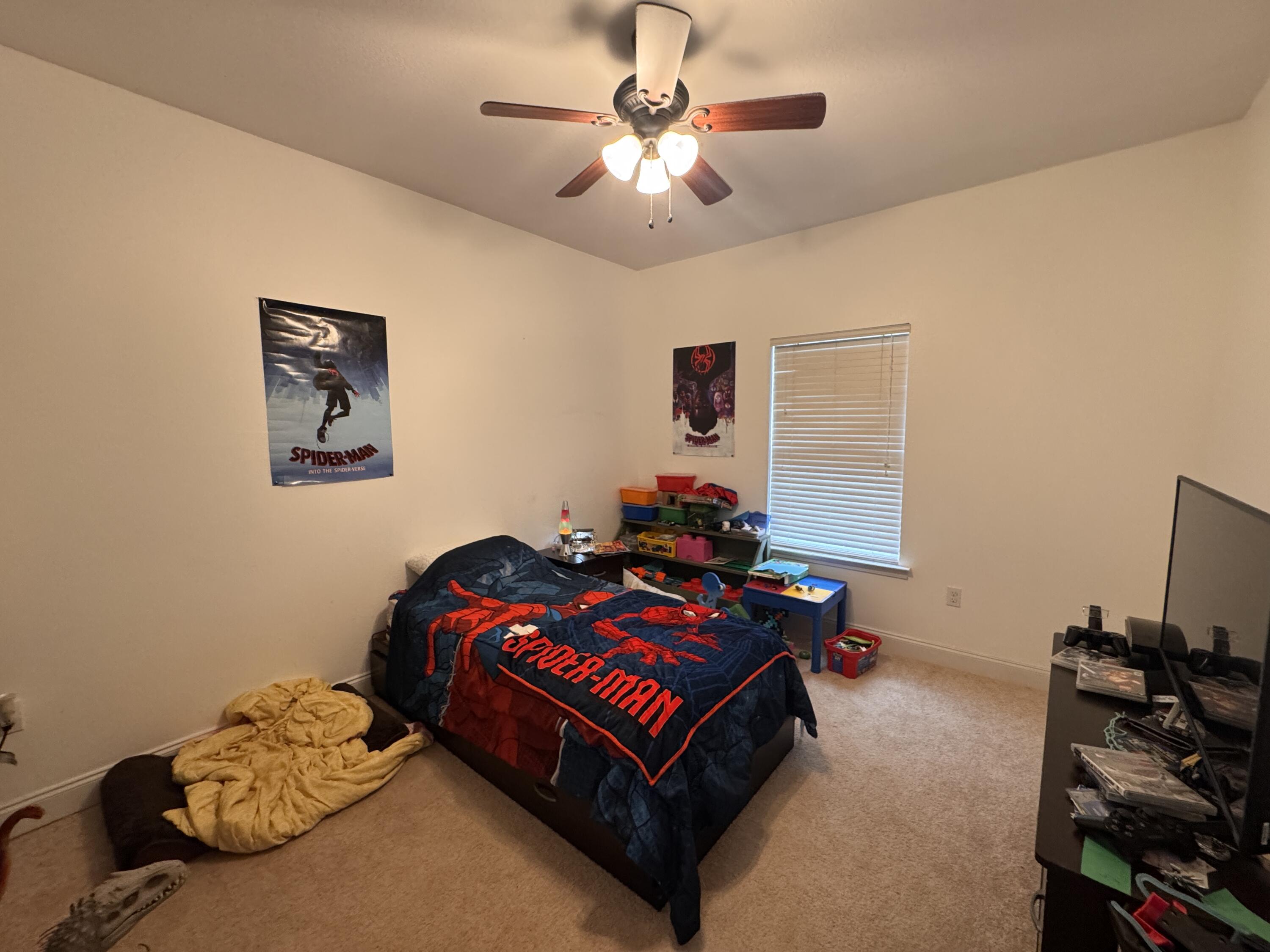 4413 Mirada Way Crestview, FL 32539 - Photo 17 of 27 a bedroom with bed and a chandelier