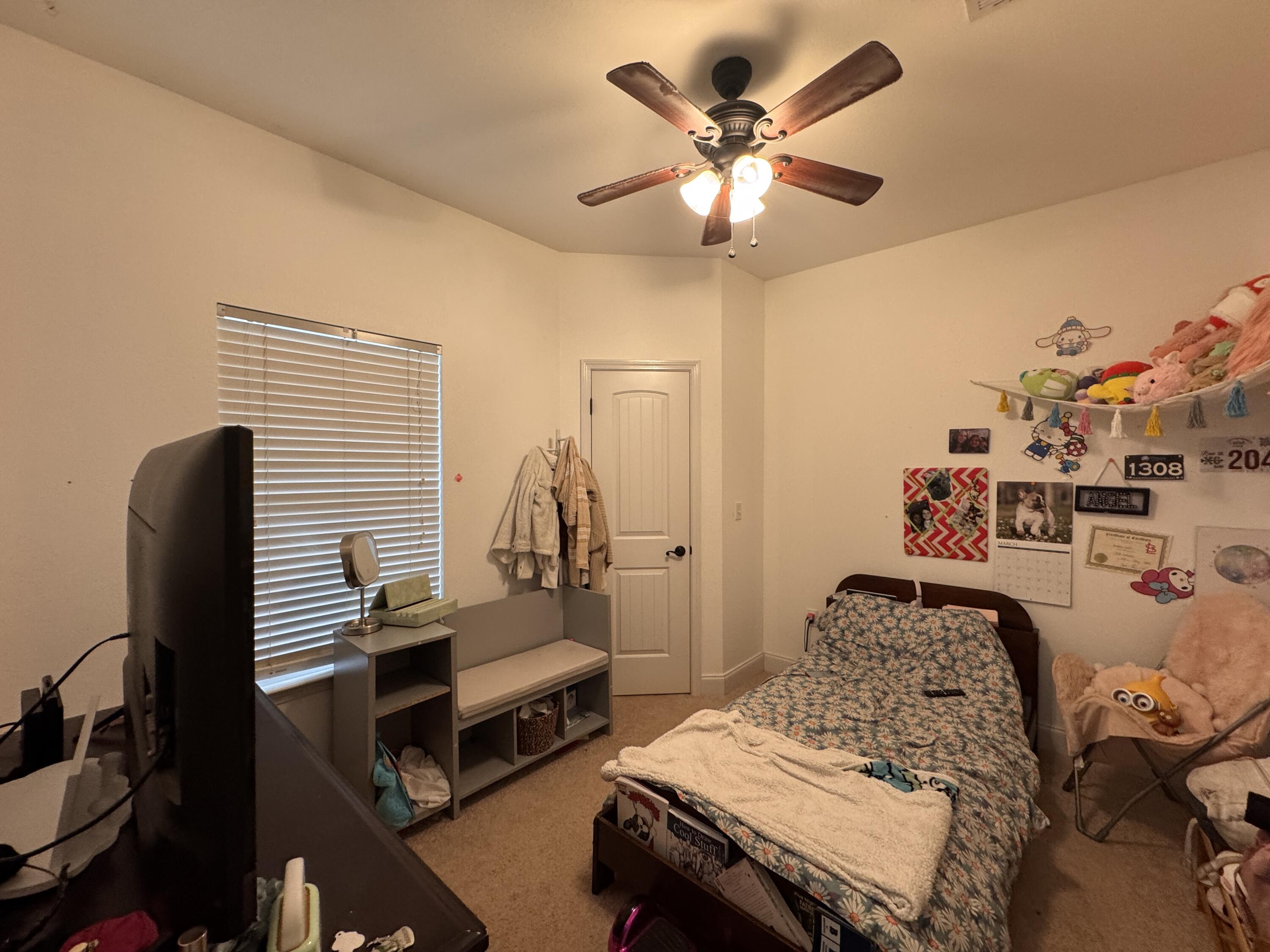4413 Mirada Way Crestview, FL 32539 - Photo 22 of 27 a bedroom with furniture and a chandelier
