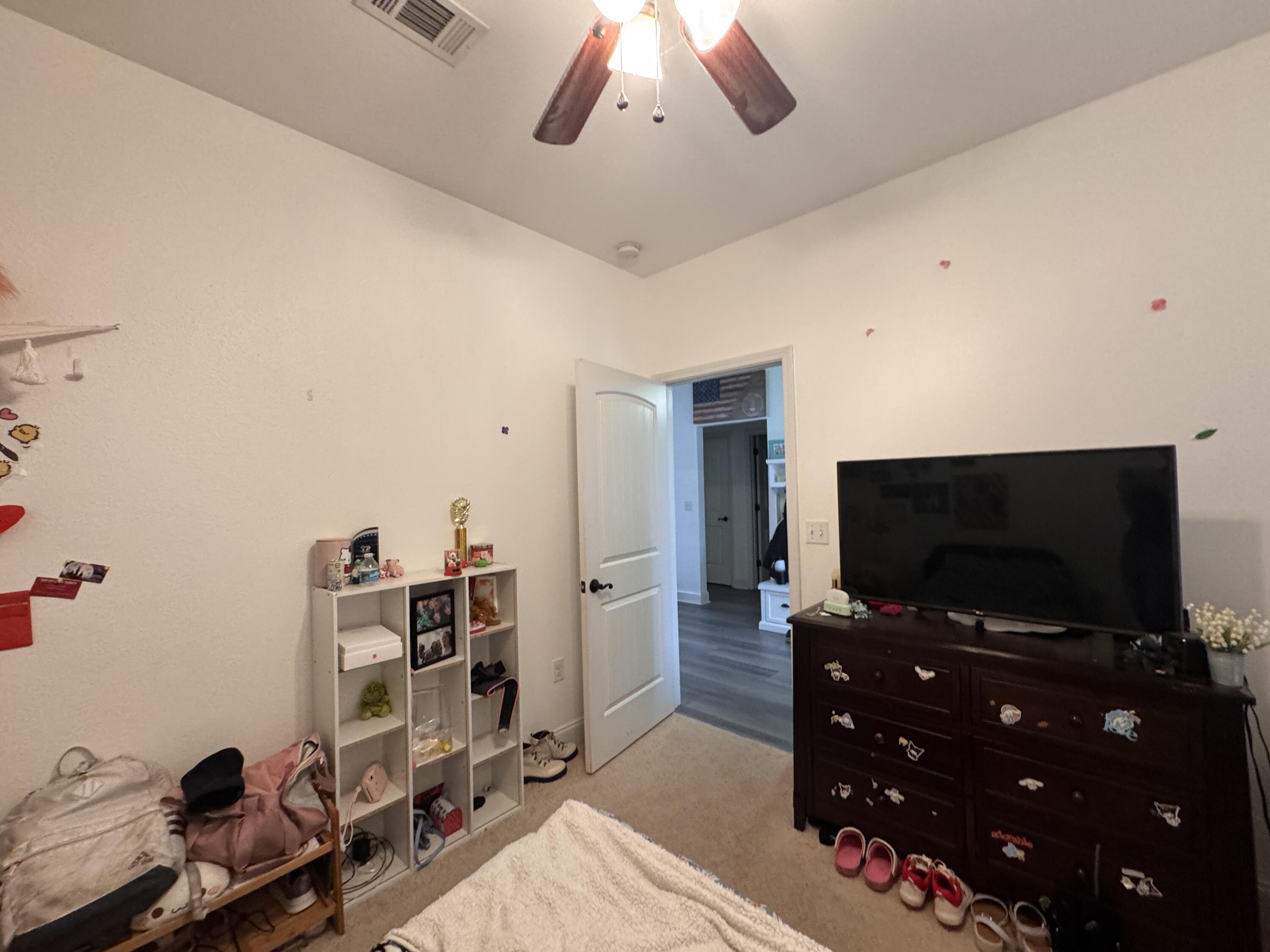 4413 Mirada Way Crestview, FL 32539 - Photo 23 of 27 a room with furniture and flat screen tv