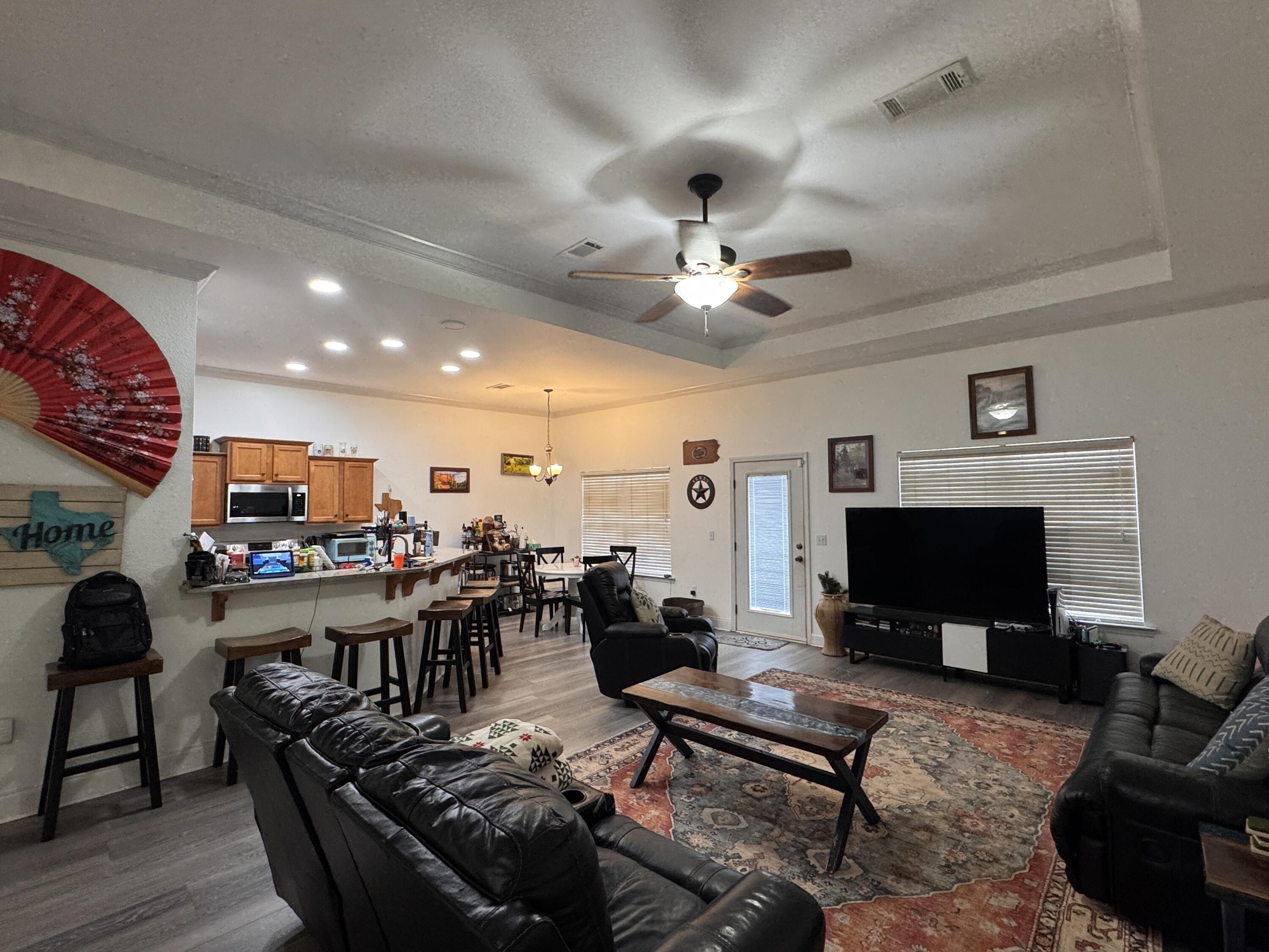 4413 Mirada Way Crestview, FL 32539 - Photo 5 of 27 a living room with furniture and a flat screen tv