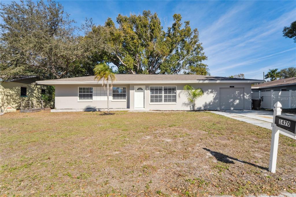 1470 Overlea Street Clearwater, FL 33755 - Photo 1 of 1 front view of a house with a yard
