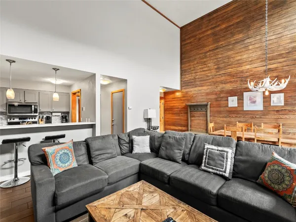 a living room with a couch and a stove top oven