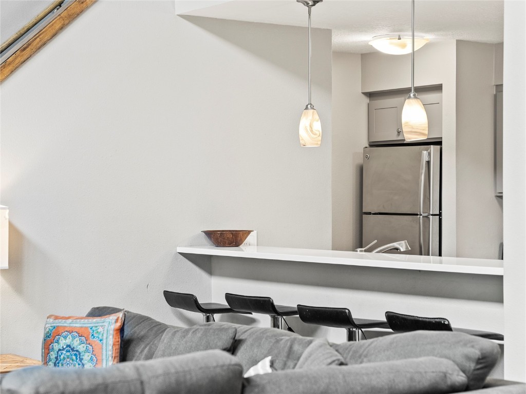 22320 Highway 6, Unit 1761 Keystone, CO 80435 - Photo 17 of 33 a living room with a couch and a chandelier